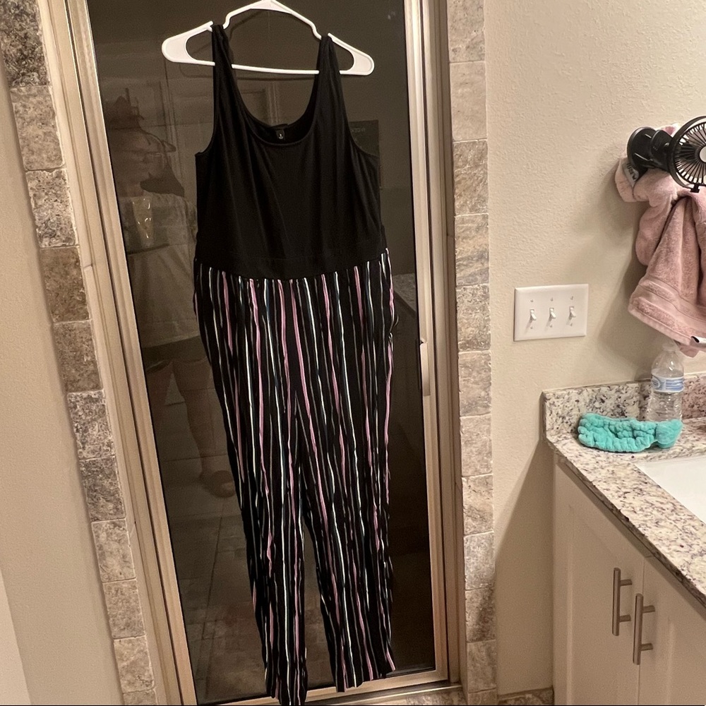 Black romper with striped pant legs